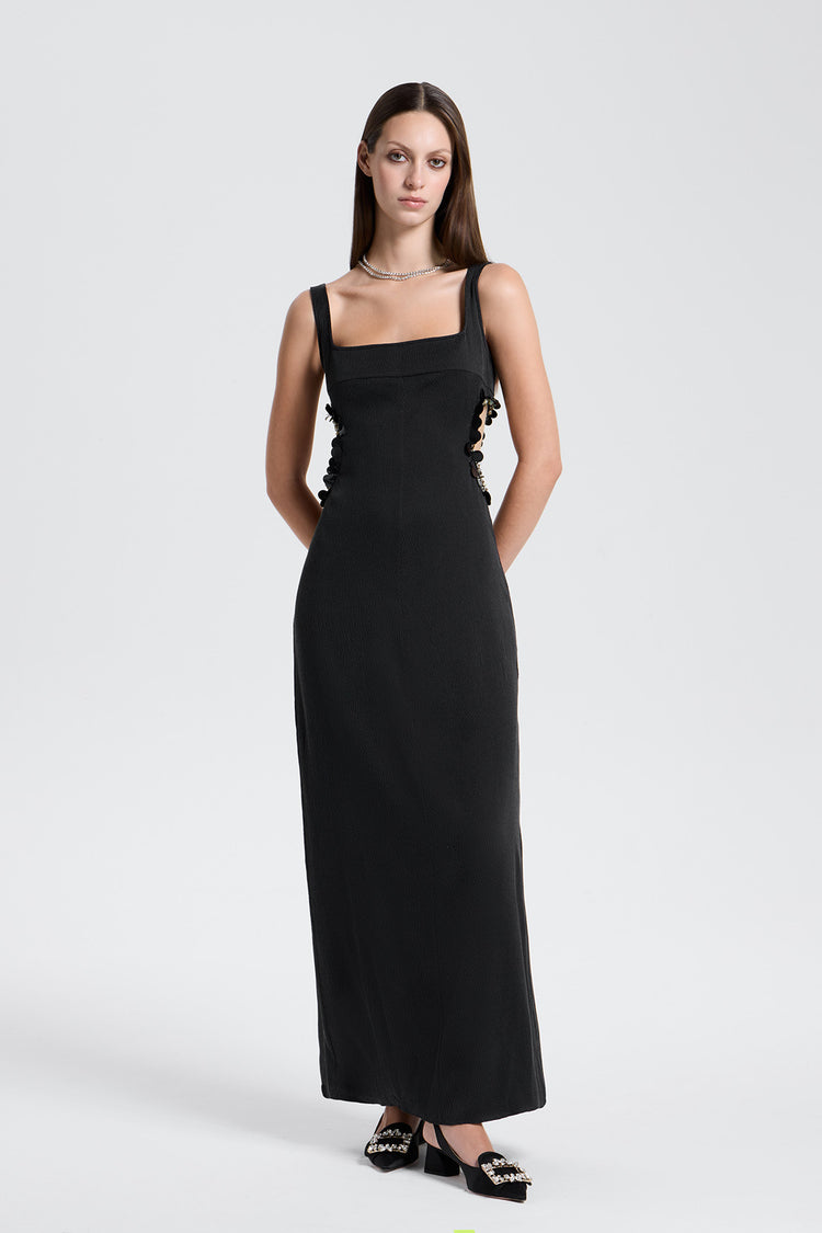 Woman wearing a black evening gown on a white background